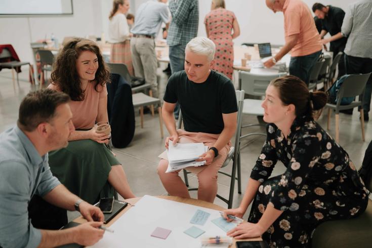 People speaking around a table